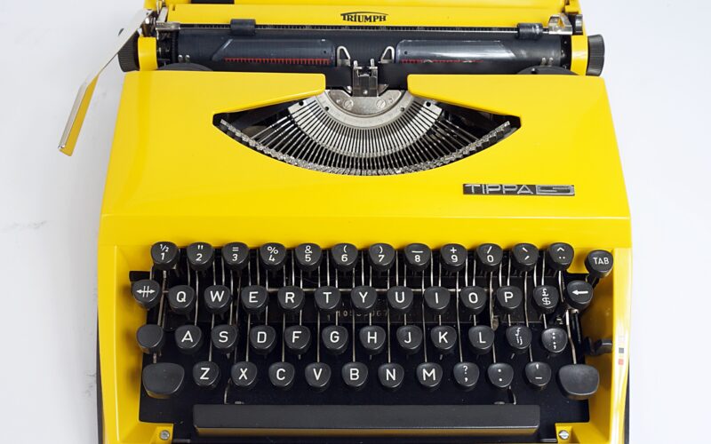 Yellow Triumph Tippa S Typewriter