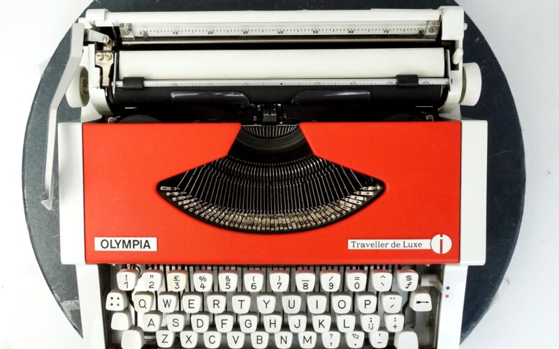Orange Olympia Traveller Typewriter