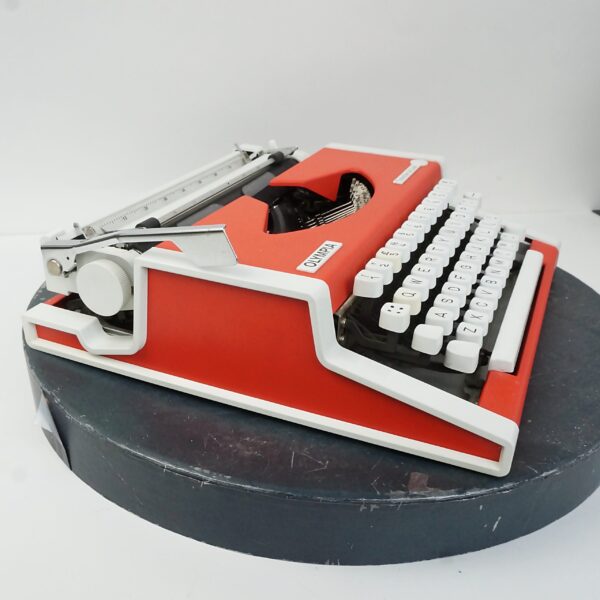 Orange Olympia traveller typewriter
