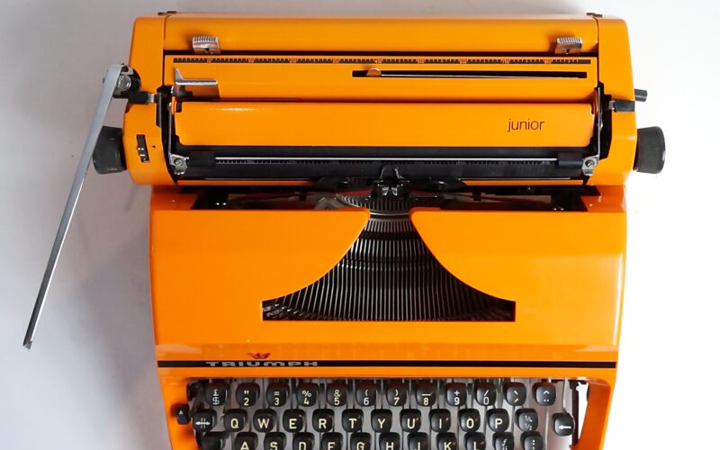 Orange Triumph Junior Typewriter