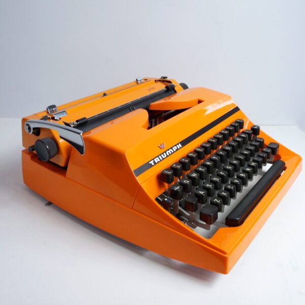 Orange triumph junior typewriter