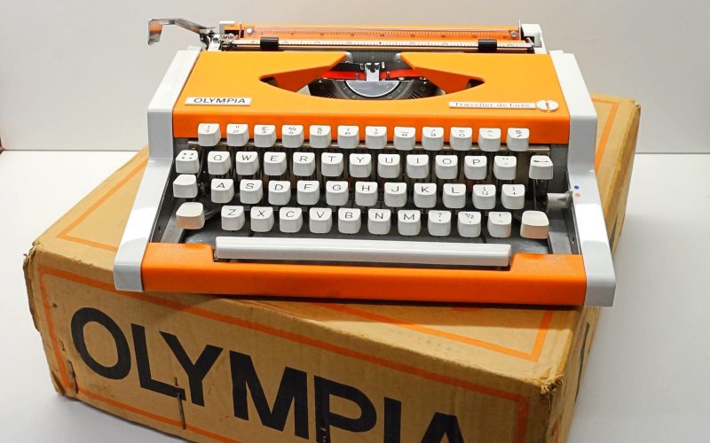 Orange Olympia Traveller deLuxe Typewriter